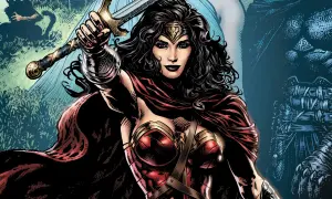 Wonder Woman z mieczem wzniesionym do góry, w czerwonej pelerynie i zbroi.