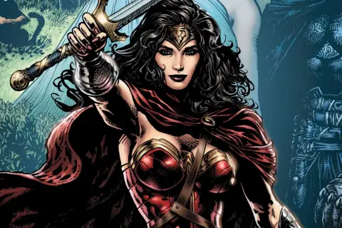 Wonder Woman z mieczem wzniesionym do góry, w czerwonej pelerynie i zbroi.