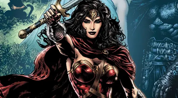 Wonder Woman z mieczem wzniesionym do góry, w czerwonej pelerynie i zbroi.