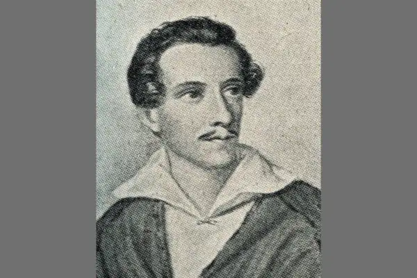 Portret mężczyzny w stylu romantycznym, z wąsami i bujnymi włosami, w białej koszuli i ciemnej marynarce.